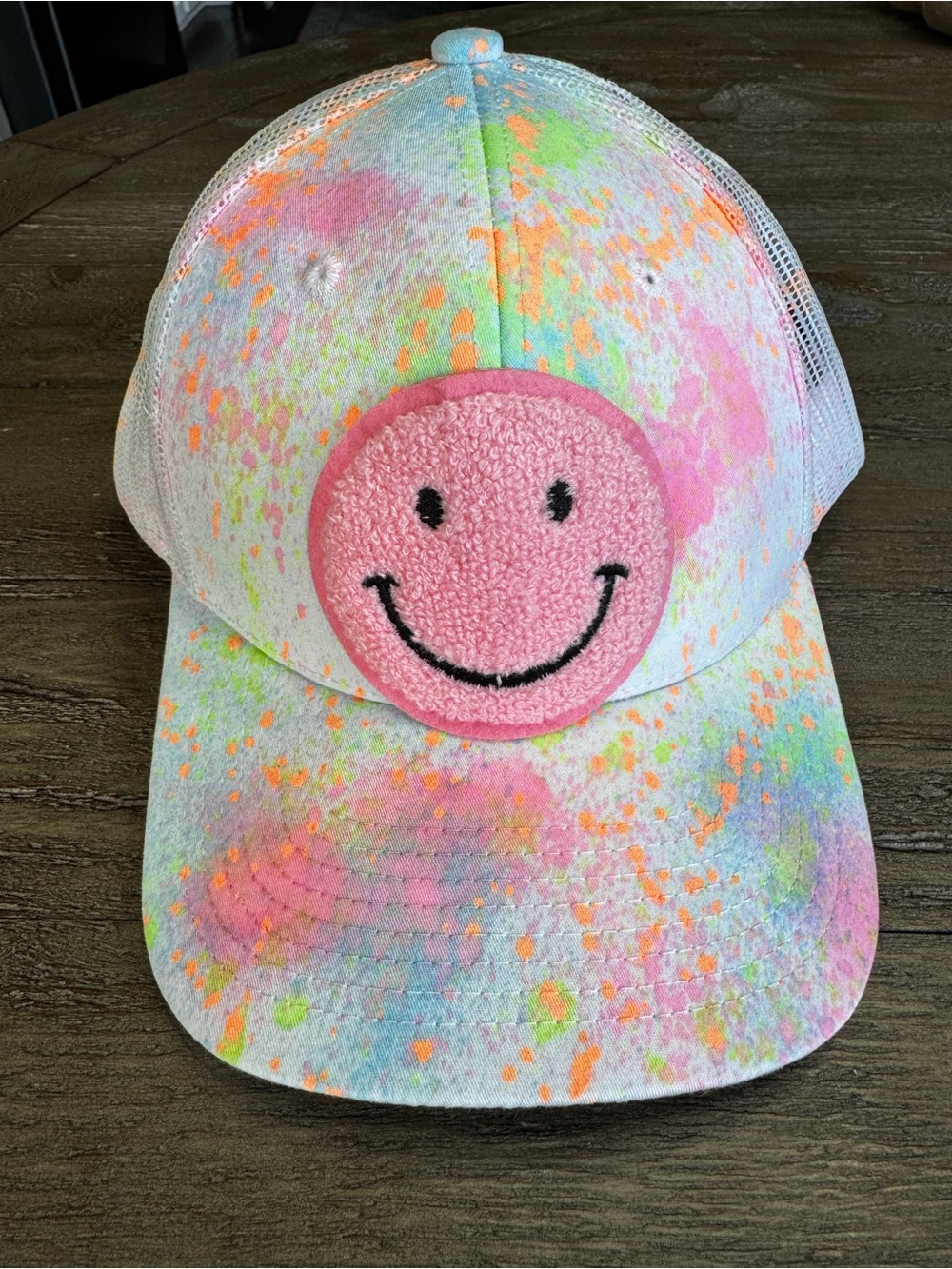 Neon Paint Splatter Smiley Face Trucker Hat